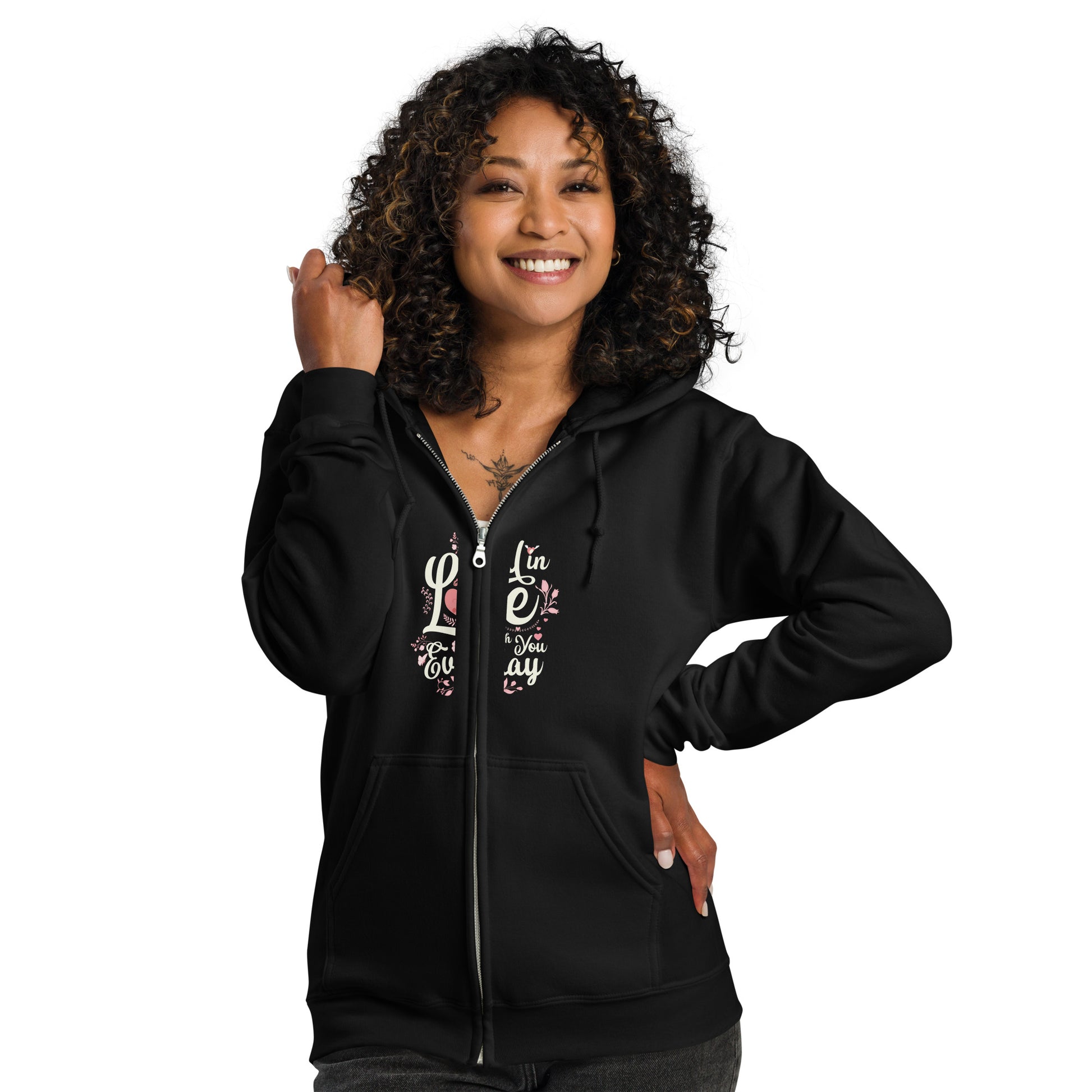 Woman wearing a black floral Fido zip hoodie, showcasing a vintage dog design and bloom accents, perfect for stylish warmth.